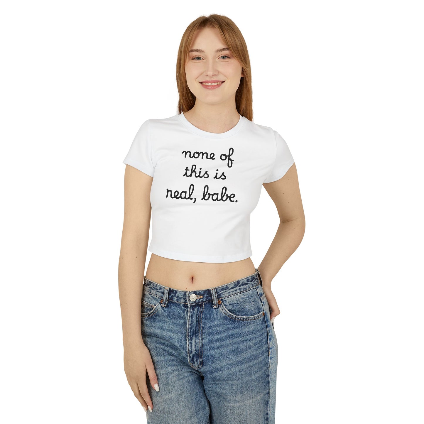 Baby Tee — "none of this is real, babe." Cropped Graphic Tee