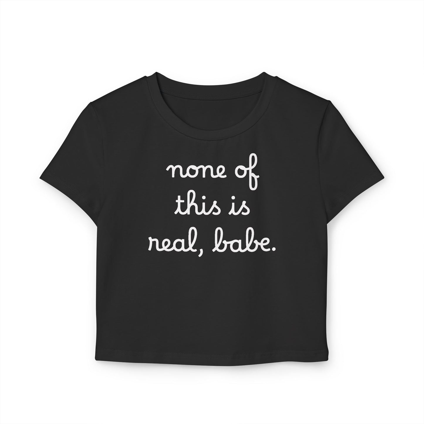 Baby Tee — "none of this is real, babe." Cropped Graphic Tee