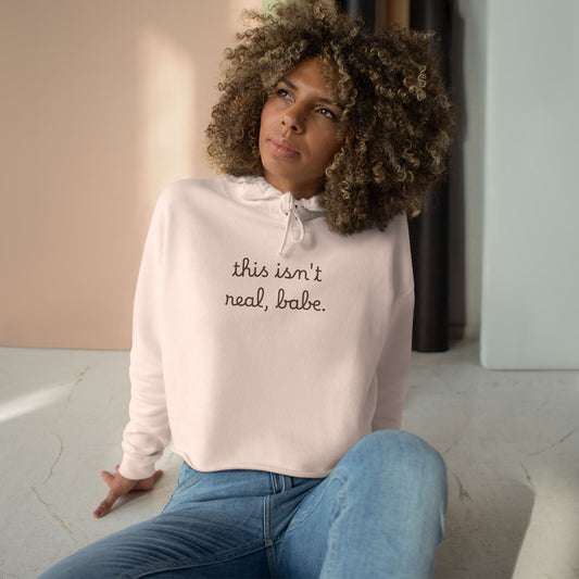 Cropped Hoodie — "this isn't real, babe." Minimal Script Crop Sweatshirt