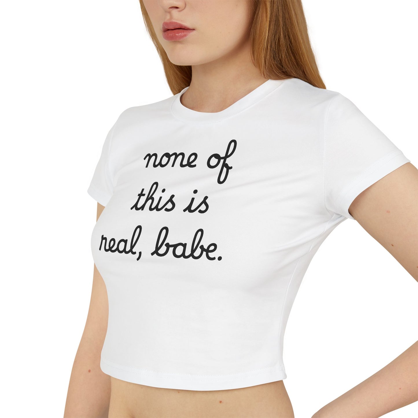 Baby Tee — "none of this is real, babe." Cropped Graphic Tee