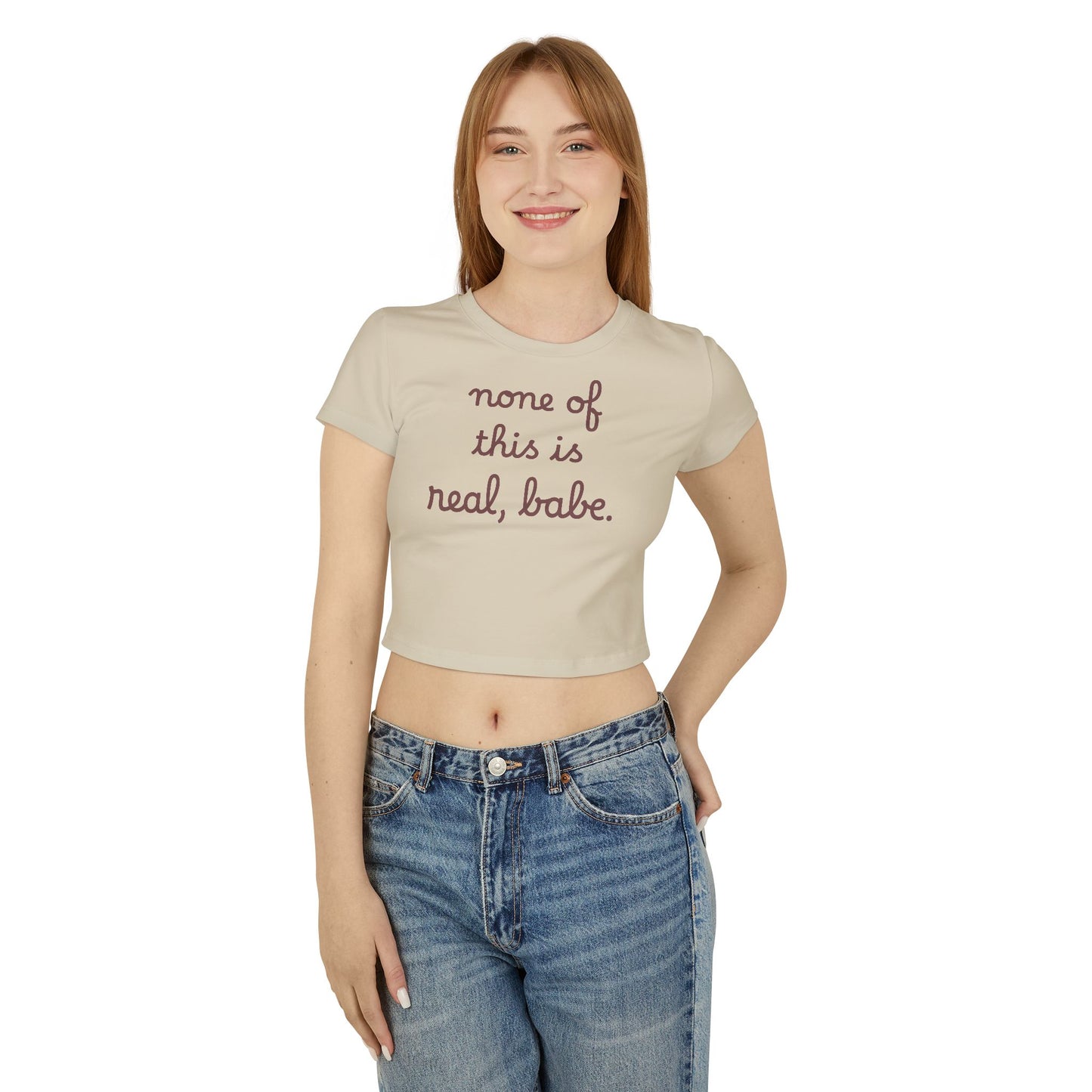 Baby Tee — "none of this is real, babe." Cropped Graphic Tee
